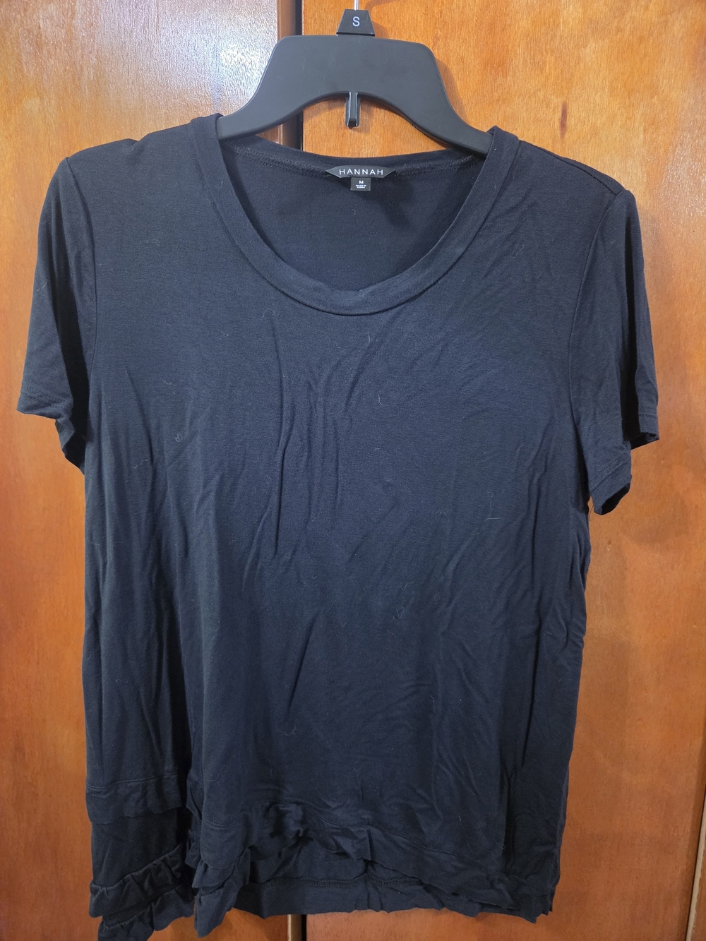 Hannah Black Short Sleeve Crewneck Tee with Ruffle Hem